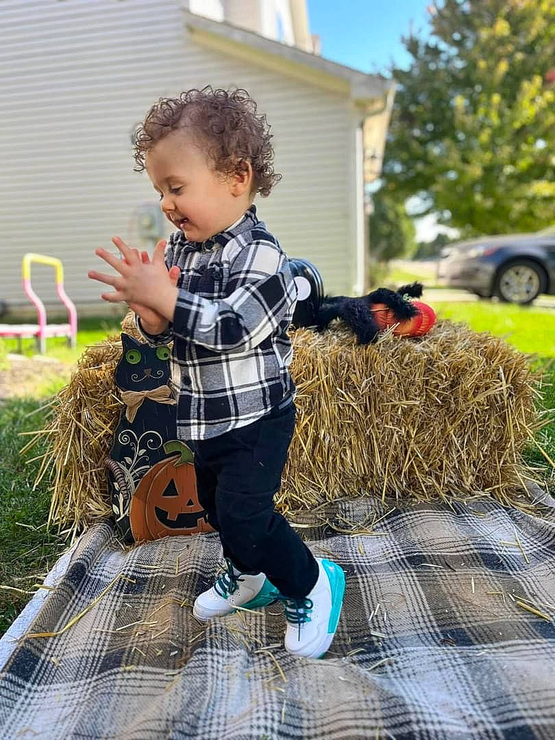 Jacob joined the competition — help win amazing prizes! child, denim, flooring, fun, grass, happy, house, leisure, pattern, people_in_nature, person, plaid, plant, recreation, sleeve, tartan, tire, toddler, tree, wheel