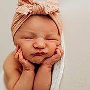 Renesmé is registered to the contest to win money with this photo: newborn, baby, infant, headband, bow, sleeping, hands, face, skin, blanket, portrait, closeup, soft, peaceful, cute, resting, child, toddler, young, adorable