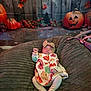 Renesmé is registered to the contest to win money with this photo: baby, sleeping, dress, headband, pumpkin_pattern, blanket, fall_decor, jack_o_lantern, halloween, autumn_leaves, indoor, soft_texture, child, festive, cute, infant, cozy, holiday, portrait, resting
