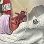 Benny joined the competition — help win amazing prizes! newborn, baby, hospital, incubator, blanket, hat, infant, sleeping, medical, healthcare, person, face, bed, tubing, care, small, wrapped, cute, peaceful, indoor