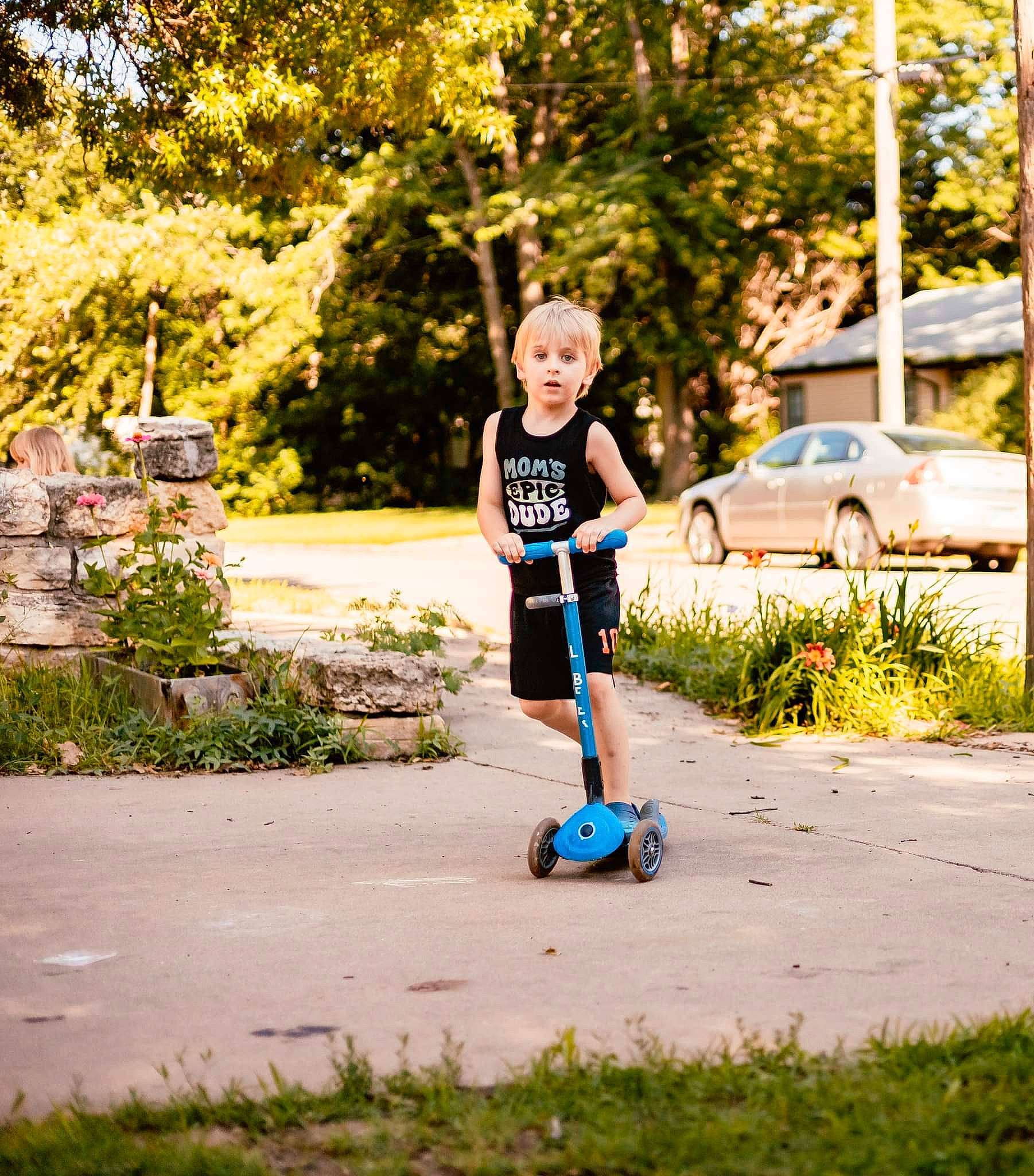 James joined the competition — help win amazing prizes! asphalt, automotive_tire, automotive_wheel_system, car, electric_blue, grass, happy, leisure, people_in_nature, person, plant, recreation, road_surface, rolling, sidewalk, t_shirt, tire, toddler, tree, vehicle