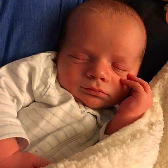 Gary is registered to the contest to win money with this photo: bedtime, cheek, child, ear, finger, forehead, girl, hand, head, infant, lip, mouth, nap, nose, person, skin, sleep, toddler