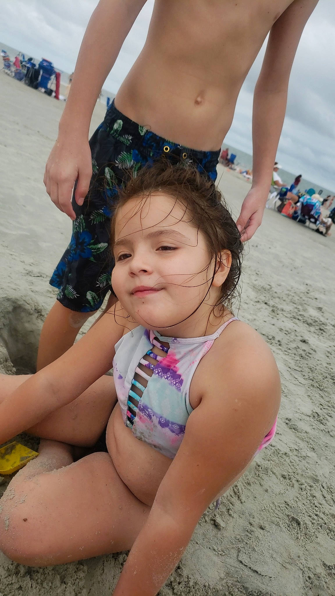 Amelia is registered to the contest to win money with this photo: abdomen, beach, bikini, child, fun, leg, person, sand, spring_break, summer, sun_tanning, swimsuit_top, swimwear, thigh, toddler, trunk, undergarment, vacation