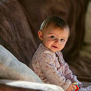 Lexana participe au concours pour gagner de l'argent avec cette photo : baby, infant, child, smile, sofa, blanket, toy, pajamas, portrait, indoor, cozy, cute, bokeh, hands, face, eyes, seat, soft_light, playtime, home