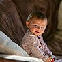 baby, infant, child, smile, sofa, blanket, toy, pajamas, portrait, indoor, cozy, cute, bokeh, hands, face, eyes, seat, soft_light, playtime, home