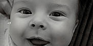 Teddie joined the competition — help win amazing prizes! baby, smiling, face, blanket, close_up, black_and_white, infant, happy, cute, portrait, child, clothing, soft_texture, indoors, young, person, skin, eyes, mouth, expression