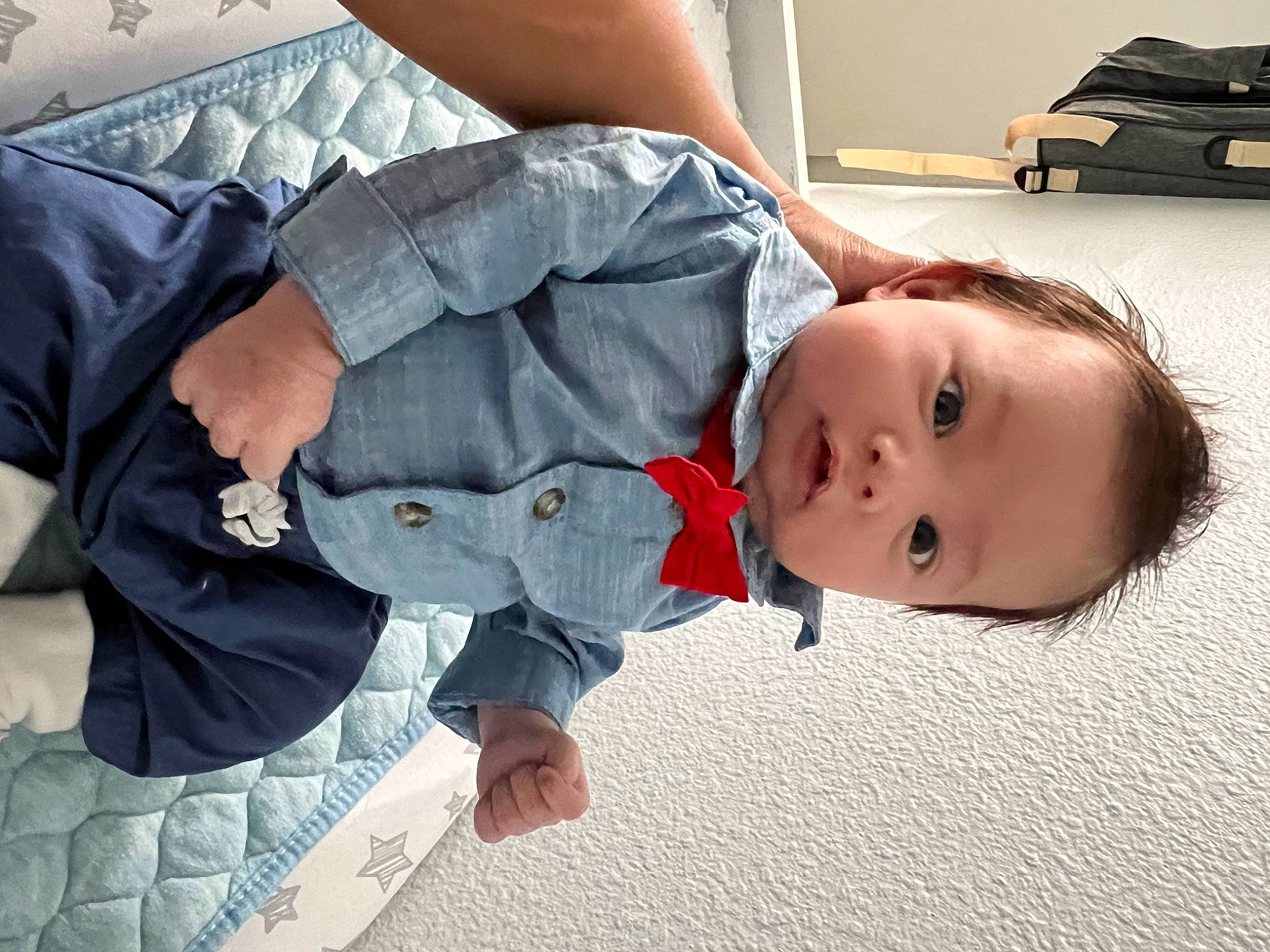 Jeremy is registered to the contest to win money with this photo: abdomen, baby, baby_toddler_clothing, bag, baggage, box, child, comfort, denim, elbow, flooring, gesture, joint, lap, luggage_and_bags, person, sitting, sleeve, toddler, tree