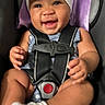 baby, smiling, car_seat, headband, white_bow, socks, infant, happy, child, seatbelt, clothing, portrait, cute, sitting, young_child, indoor, person, baby_girl, secure, closeup