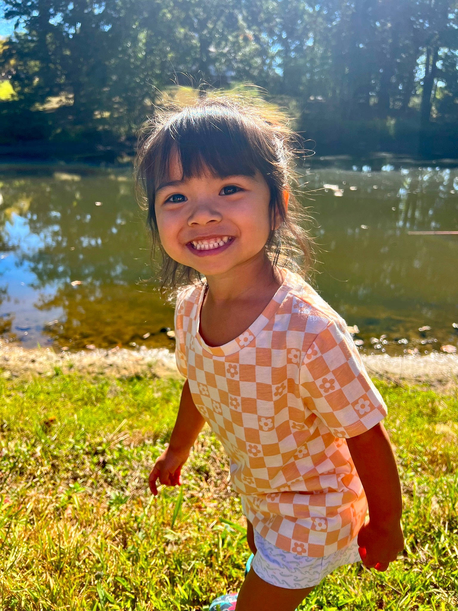 Shiloh joined the competition — help win amazing prizes! bank, botany, eye, flash_photography, fun, grass, happy, human_body, joy, lake, leisure, morning, natural_environment, people_in_nature, person, plant, skin, smile, summer, toddler