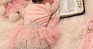 Dasha Umana is registered to the contest to win money with this photo: baby, newborn, child, sleeping, pink_clothing, dress, tutu, leopard_print, socks, teddy_bear, bible, book, floral_arrangement, pink_decor, crown, heart_pillow, faux_fur, nursery, portrait, indoor