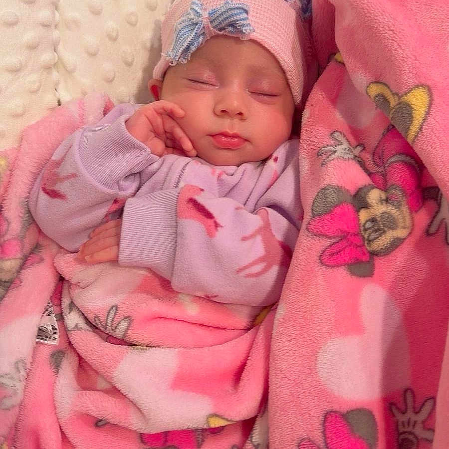 Dasha Umana joined the competition — help win amazing prizes! newborn, baby, sleeping, infant, portrait, face, pink, blanket, minnie_mouse, headband, clothing, cozy, cushion, indoors, nap, peaceful, cute, covered, textile, close_up