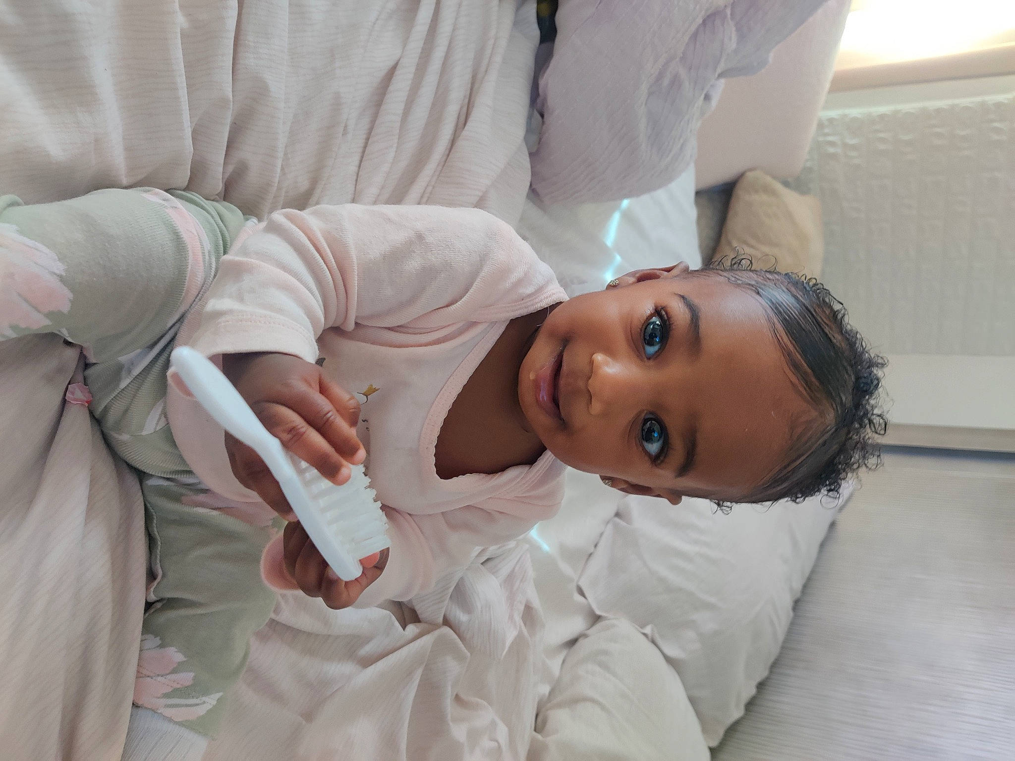 Delaney is registered to the contest to win money with this photo: baby, baby_products, baby_toddler_clothing, bed, bed_sheet, bedding, chest, child, comfort, eyelash, flooring, fur, human_body, linens, person, room, skin, sleep, sleeve, smile