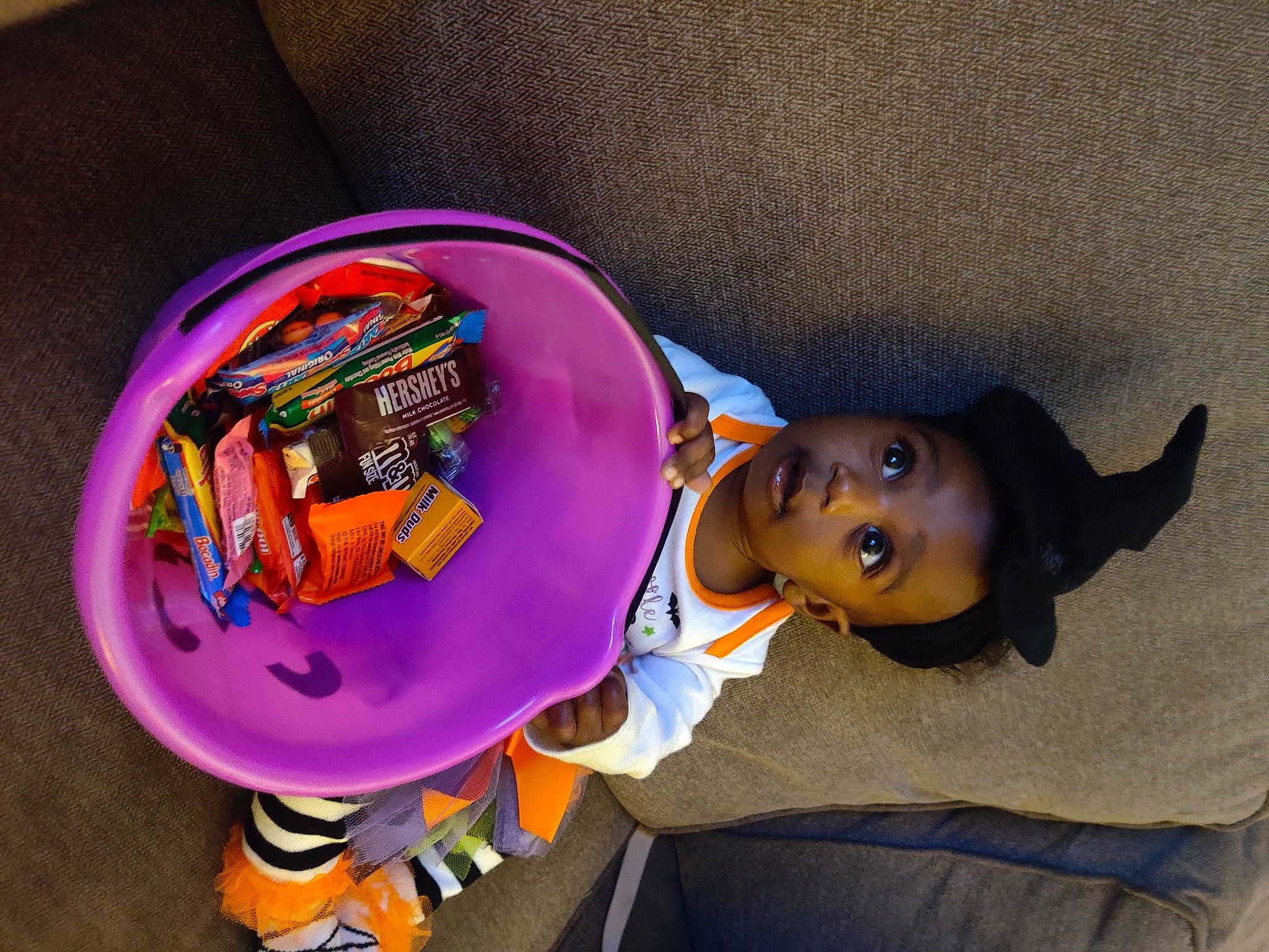 Delaney is registered to the contest to win money with this photo: animation, child, dessert, doll, fashion_accessory, finger_food, food, fun, hat, junk_food, magenta, person, play, plush, purple, snack, stuffed_toy, surprise, sweetness, teddy_bear