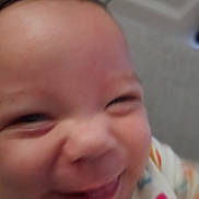 Emersyn joined the competition — help win amazing prizes! baby, infant, child, face, portrait, close_up, smiling, eyes, nose, cheeks, mouth, skin, hair, colorful_clothing, indoor, soft_focus, cropped, head, cute, photography
