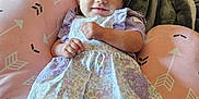 Izabella joined the competition — help win amazing prizes! baby, child, infant, smile, dress, headband, purple, pink, cushion, blanket, indoor, person, cozy, comfort, pattern, arrow, relaxing, cute, young, happy
