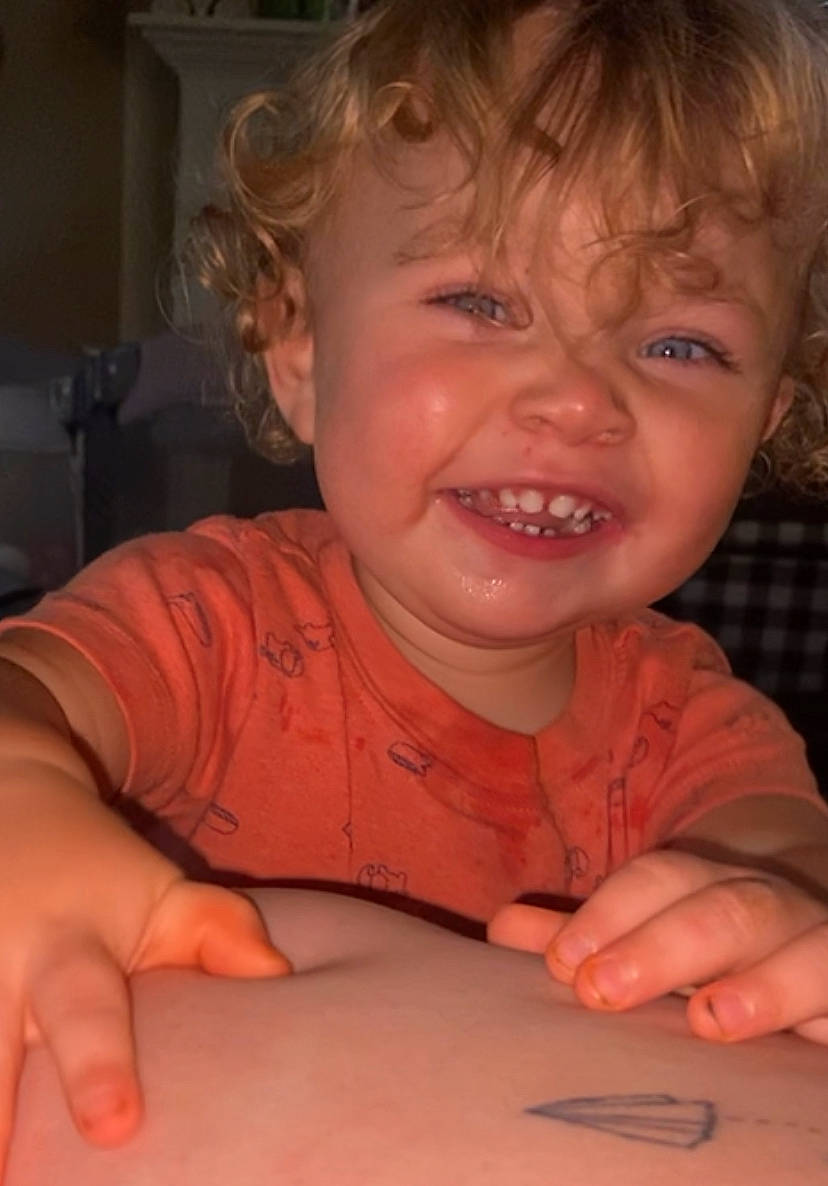 Briar is registered to the contest to win money with this photo: baby, cheek, child, dress, ear, eyebrow, eyelash, finger, forehead, hand, happy, iris, joy, lip, mouth, nose, person, skin, smile, thumb