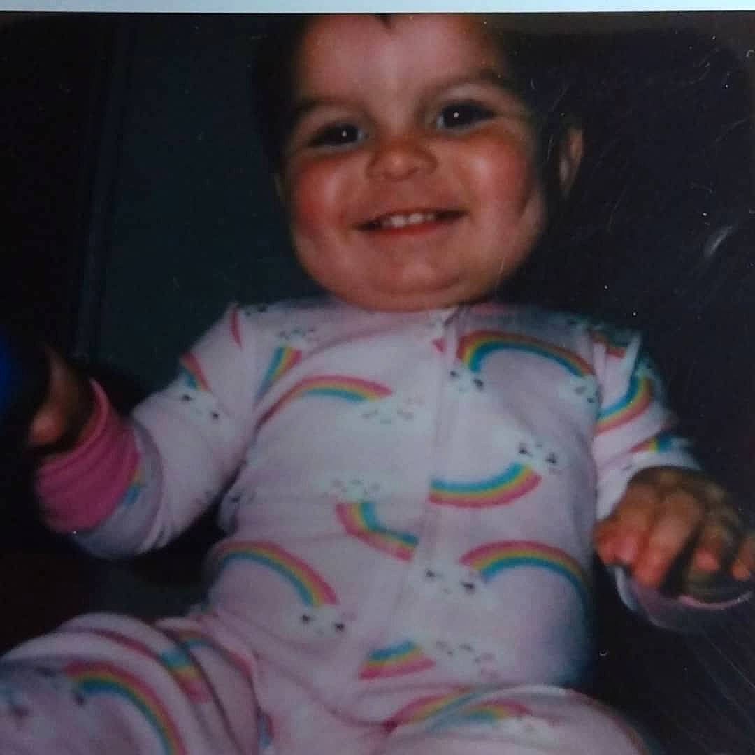 Fallon is registered to the contest to win money with this photo: baby, baby_toddler_clothing, cheek, comfort, facial_expression, finger, fun, gesture, happy, iris, joy, mouth, neck, nose, person, pink, skin, sleeve, smile, t_shirt