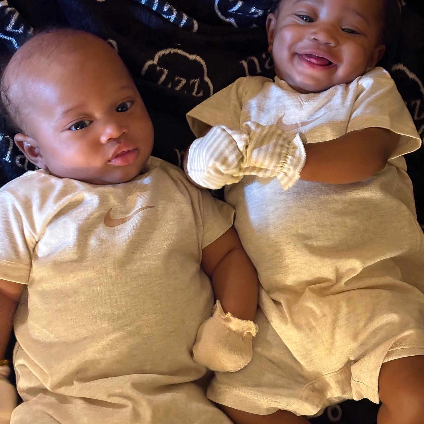 Jamiah joined the competition — help win amazing prizes! baby, infant, smiling_baby, lying_down, matching_outfits, mittens, socks, bow, happy, cute, toddler, child, portrait, indoor, blanket, clothing, two_children, skin, face, expression