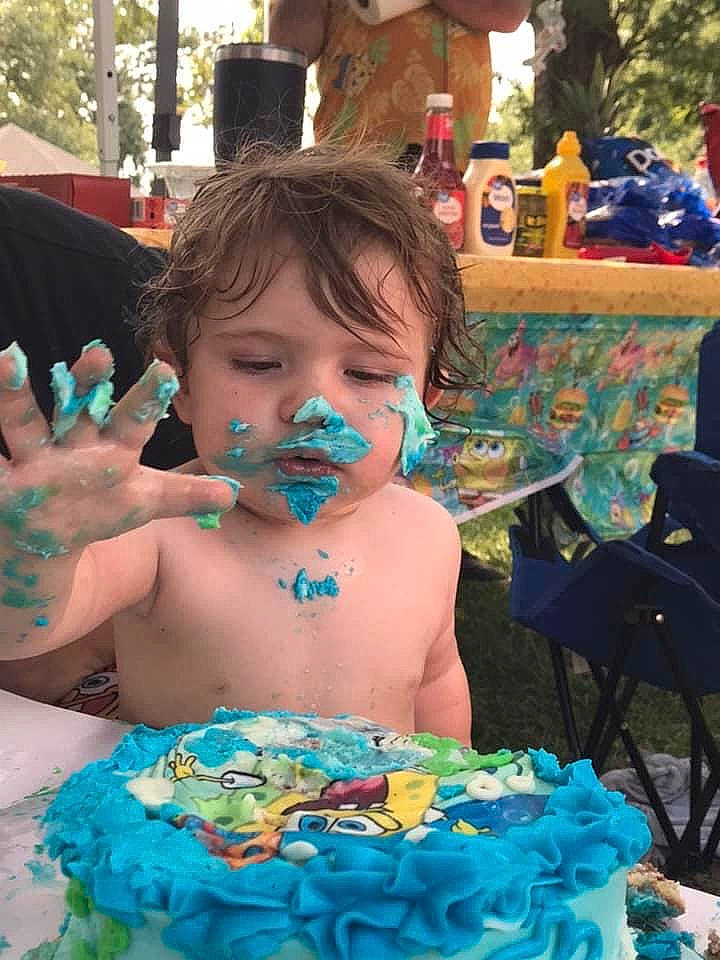 Tyrone is registered to the contest to win money with this photo: aqua, baked_goods, birthday_cake, blue, cake, cake_decorating, cake_decorating_supply, child, cream, dessert, event, food, fun, green, happy, icing, leisure, person, sugar_cake, toddler