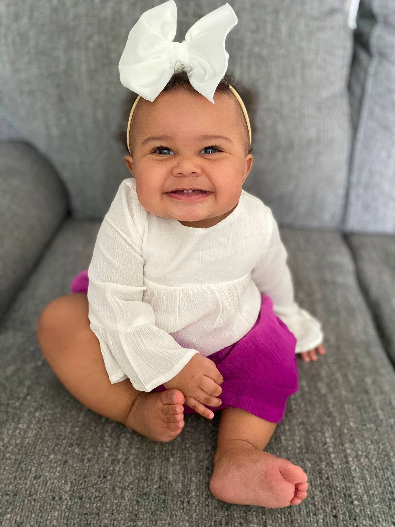 Zaria is registered to the contest to win money with this photo: baby, baby_toddler_clothing, child, costume, costume_accessory, crown, ear, face, hair_accessory, head, headgear, headpiece, headwear, joy, organ, person, pink, product, purple, skin