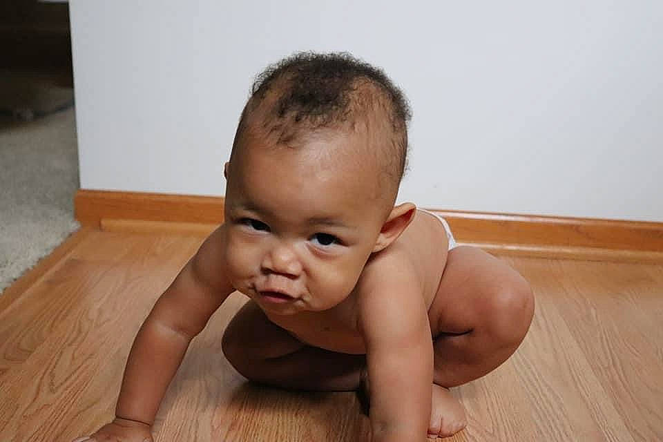 Prince is registered to the contest to win money with this photo: abdomen, baby, baby_crawling, baby_toddler_clothing, barefoot, bathing, cheek, chest, crawling, floor, flooring, foot, happy, hardwood, human_leg, person, sitting, thumb, toddler, wood