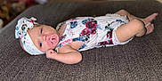 Everleigh Janis Mae is registered to the contest to win money with this photo: baby, child, closeup, cute, fabric, floral_outfit, headband, indoor, infant, lying_down, newborn, pacifier, peaceful, person, portrait, resting, skin, small_arms, small_legs, soft_focus