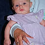 adult_hand, baby, blue_eyes, calm_expression, child, close_up, cute, drool, hand, holding, indoor, infant, lavender_dress, person, portrait, ring, short_hair, soft_lighting, striped_pants, young_child