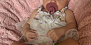 Everleigh Janis Mae joined the competition — help win amazing prizes! baby, infant, pacifier, headband, flower, blanket, pink, clothing, cute, lying_down, skin, human, child, toddler, relaxing, indoors, soft_texture, comfort, small_hands, small_feet