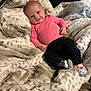 Everleigh Janis Mae joined the competition — help win amazing prizes! baby, infant, smile, pink_shirt, polka_dot_pants, socks, blanket, leopard_print, soft_texture, cute, happy, lying_down, indoor, cozy, child, face, small_hands, footwear, warm, comfort