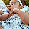 Taverly-Rose is registered to the contest to win money with this photo: baby, infant, child, face, headband, clothing, dress, floral_pattern, hand, skin, portrait, outdoor, nature, greenery, cute, young, expression, person, closeup, soft_light