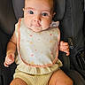 baby, infant, car_seat, bib, clothing, knitted_outfit, cute, child, person, face, eyes, hands, legs, seat, sitting, indoor, closeup, adorable, newborn, portrait