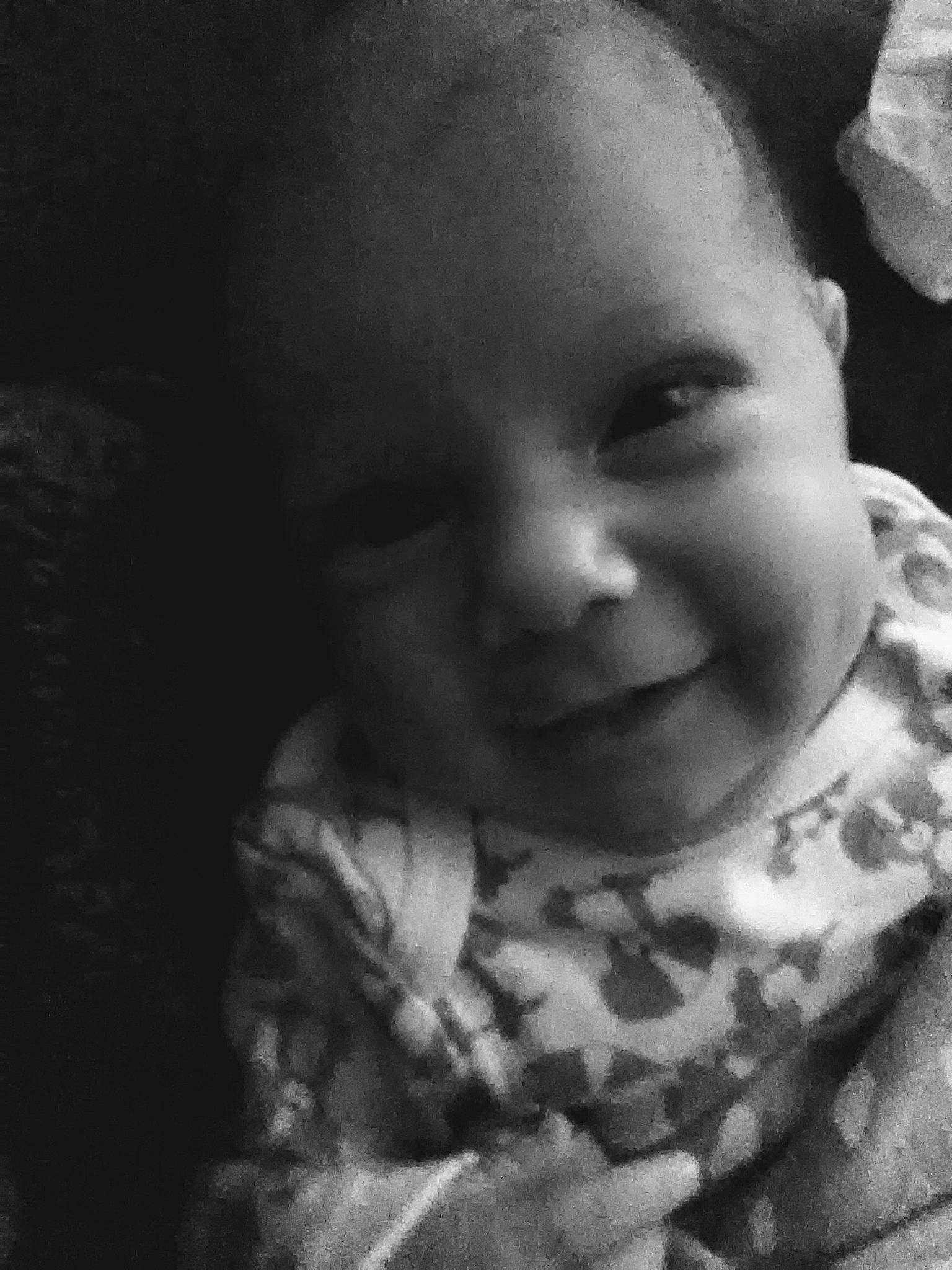 Beatrix is registered to the contest to win money with this photo: baby, black, black_and_white, cheek, child, eye, face, facial_expression, forehead, head, lip, monochrome, monochrome_photography, mouth, nose, person, photograph, photography, skin, smile