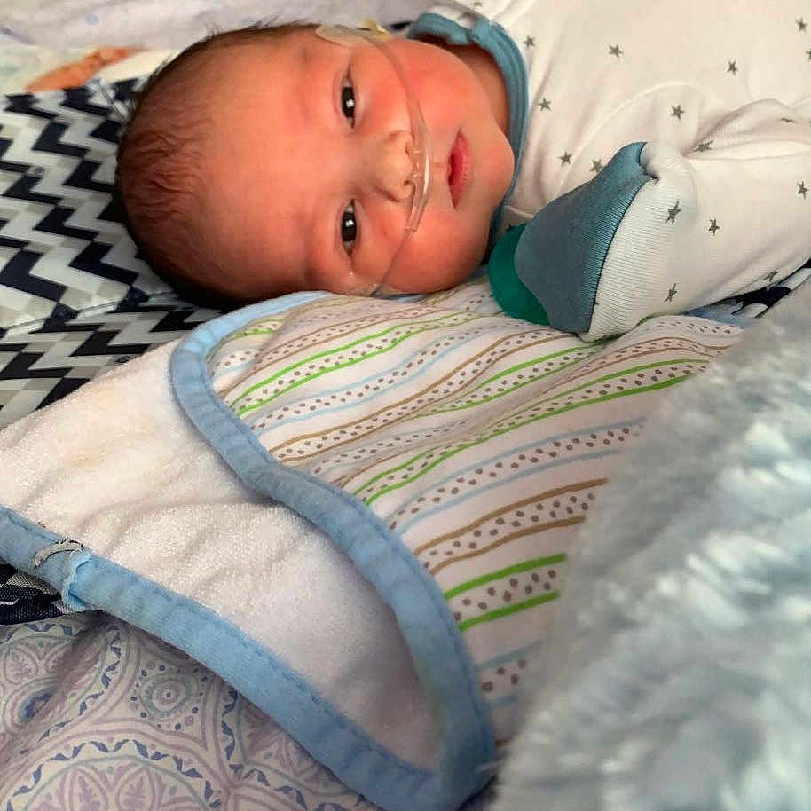 Dominic is registered to the contest to win money with this photo: baby, baby_products, baby_safety, baby_sleeping, baby_toddler_clothing, bed, bedding, bedtime, blanket, child, comfort, eye, linens, nap, pattern, room, skin, sleep, textile, toddler