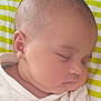 baby, sleeping, face, infant, child, onesie, clothing, cute, chubby_cheeks, peaceful, resting, closeup, portrait, head, skin, newborn, striped_background, yellow, white, soft