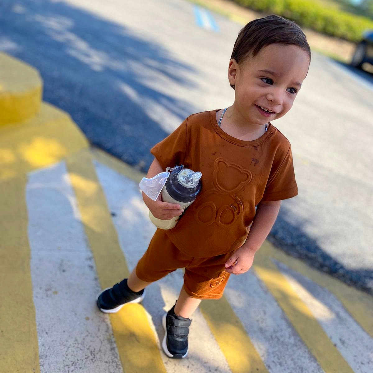 Yamil is registered to the contest to win money with this photo: bottle, boy, child, clothing, cream, dessert, face, food, frozenyogurt, hair, happy, head, icecream, male, pedestrian, person, shaker, sitting, sleeve, smile