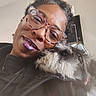 Princess Aka Tootie joined the competition — help win amazing prizes! black_and_white, close_up, companion, cuddling, curly_hair, dog, eyewear, face, fluffy, glasses, happy, home, indoor, jacket, pet, portrait, scruffy, selfie, smiling, woman
