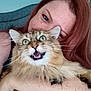 person, cat, fluffy_cat, green_eyes, red_hair, indoor, portrait, pet, animal, holding, close_up, expression, feline, cute, happy, face, whiskers, home, domestic_animal, funny