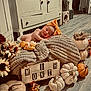 autumn, baby, blanket, booties, bow, cozy, crate, cute, decor, flooring, flowers, headband, indoors, infant, milestone, newborn, portrait, pumpkins, sleeping, wooden_sign