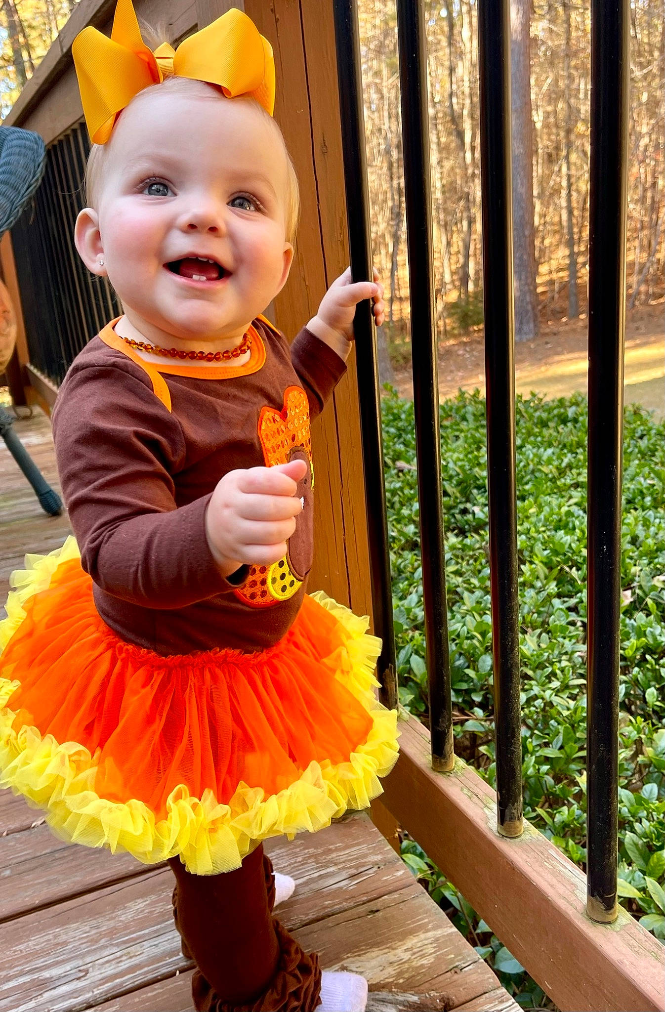 Kamdyn joined the competition — help win amazing prizes! baby, baby_toddler_clothing, child, costume, event, fence, fun, green, happy, joy, leisure, orange, person, photograph, pink, plant, ruffle, smile, snapshot, toddler