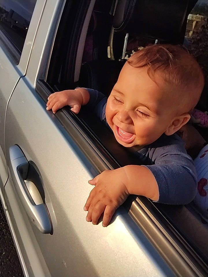 Matty is registered to the contest to win money with this photo: automotive_design, automotive_exterior, automotive_lighting, baby_toddler_clothing, bumper, car, door, hand, hood, mode_of_transport, motor_vehicle, person, personal_luxury_car, product, skin, smile, tints_and_shades, toddler, vehicle, vehicle_door