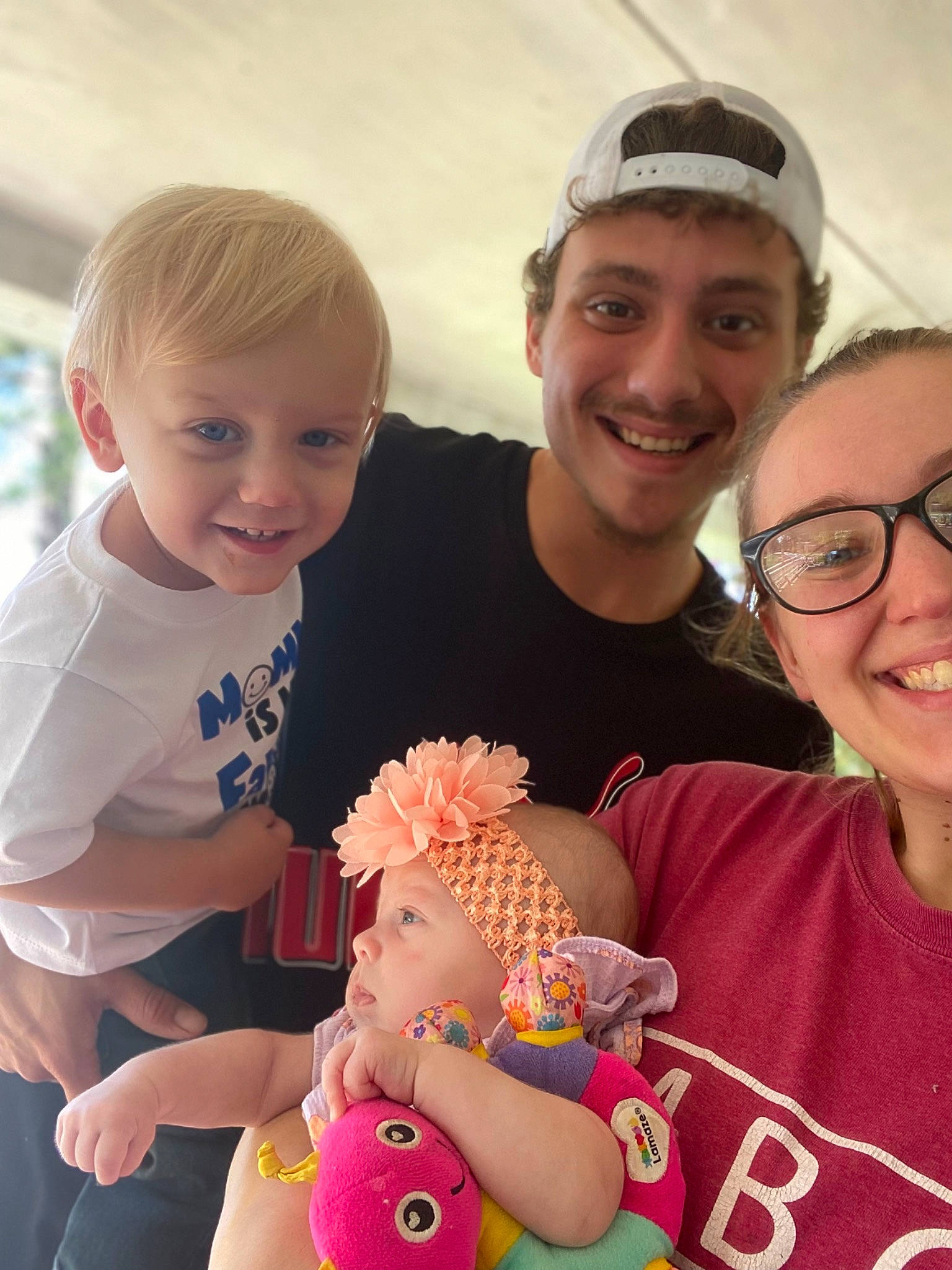 Braxton Michael is registered to the contest to win money with this photo: baby_toddler_clothing, child, eye, face, facial_expression, finger, fun, gesture, hair, happy, head, headwear, joy, muscle, organ, person, pink, product, skin, smile