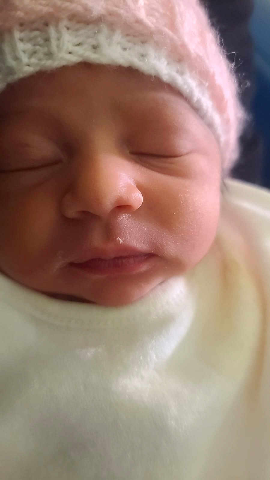 Aanuoluwapo is registered to the contest to win money with this photo: newborn, baby, sleeping, close_up, pink_hat, knitted_hat, soft_clothing, face, peaceful, infant, cute, skin_texture, portrait, child, headwear, resting, cozy, warm, indoors, toddler