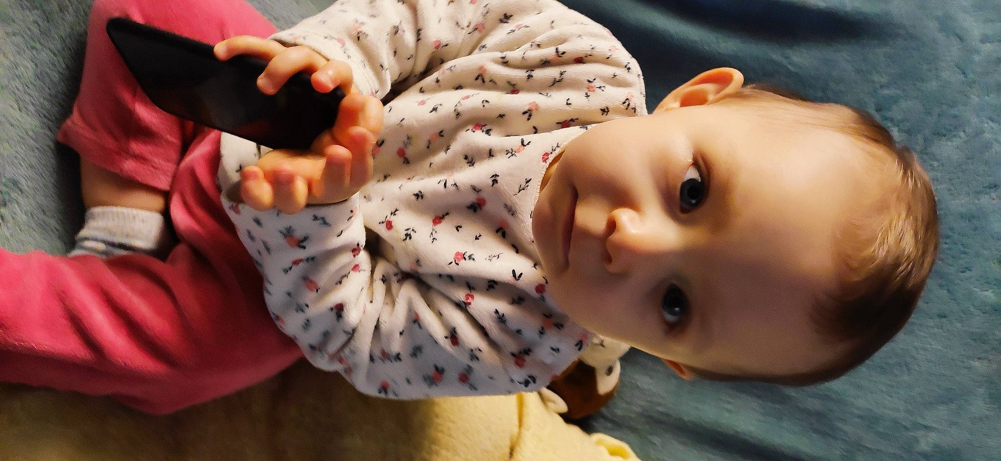 Mya participe au concours pour gagner de l'argent avec cette photo : baby, baby_products, baby_toddler_clothing, cheek, child, close_up, comfort, fun, gesture, happy, human_body, mouth, nail, nose, pattern, person, sitting, skin, sleeve, toddler