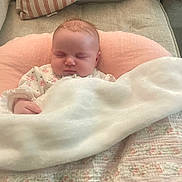 Elizabeth joined the competition — help win amazing prizes! baby, sleeping, blanket, pillow, quilt, couch, infant, cozy, comfort, rest, child, face, indoor, peaceful, soft, clothing, cute, head, person, nap