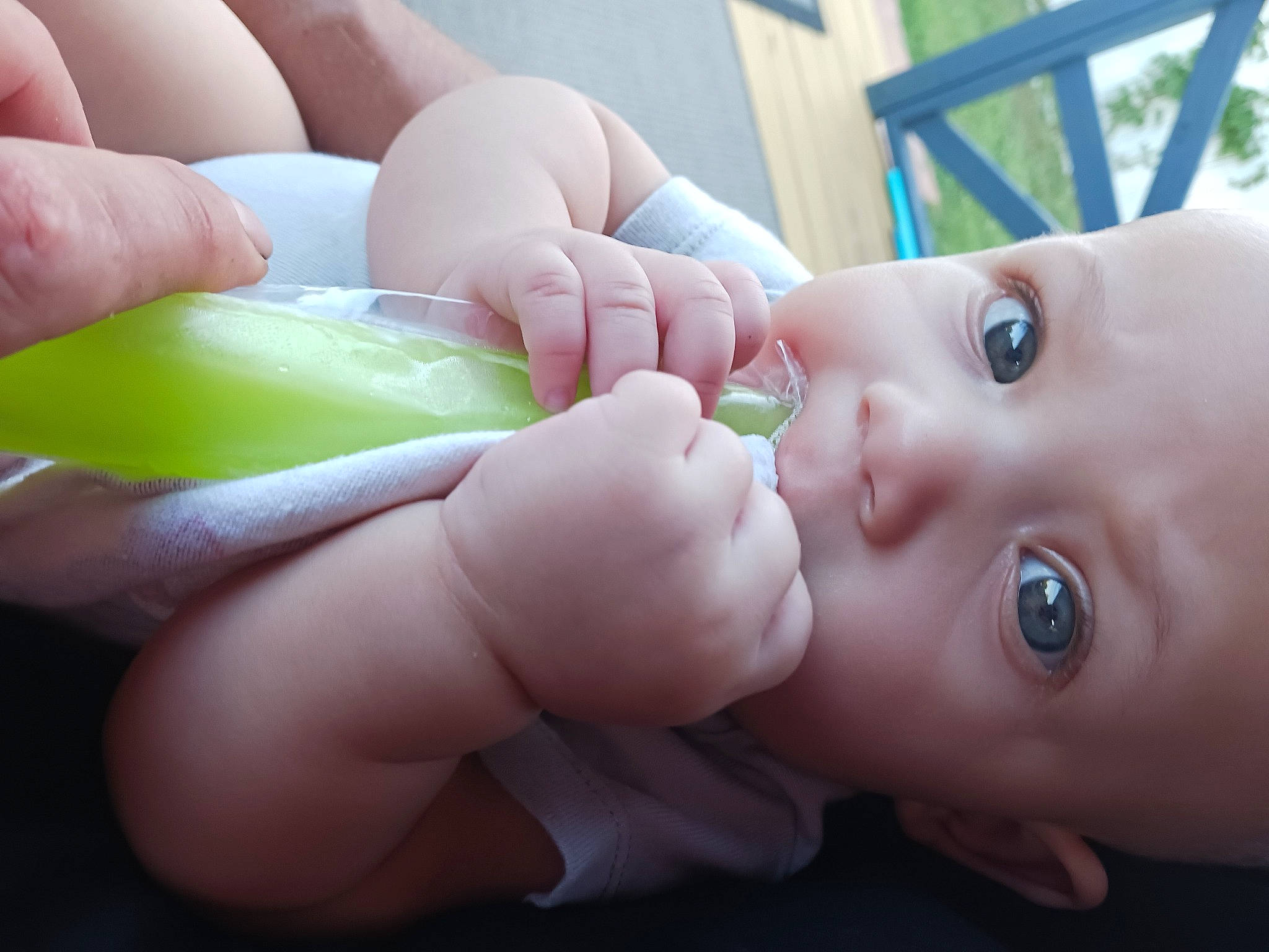 Sabrina is registered to the contest to win money with this photo: baby, baby_grabbing_for_something, cheek, eyelash, finger, gesture, grass, hand, happy, iris, lip, mouth, nail, nose, people_in_nature, person, skin, smile, thumb, toddler