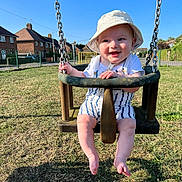 Freddie joined the competition — help win amazing prizes! baby, child, swing, playground, sunhat, smiling, outdoor, grass, sunny, summer, chains, clothing, happy, daylight, park, person, cute, legs, feet, fun