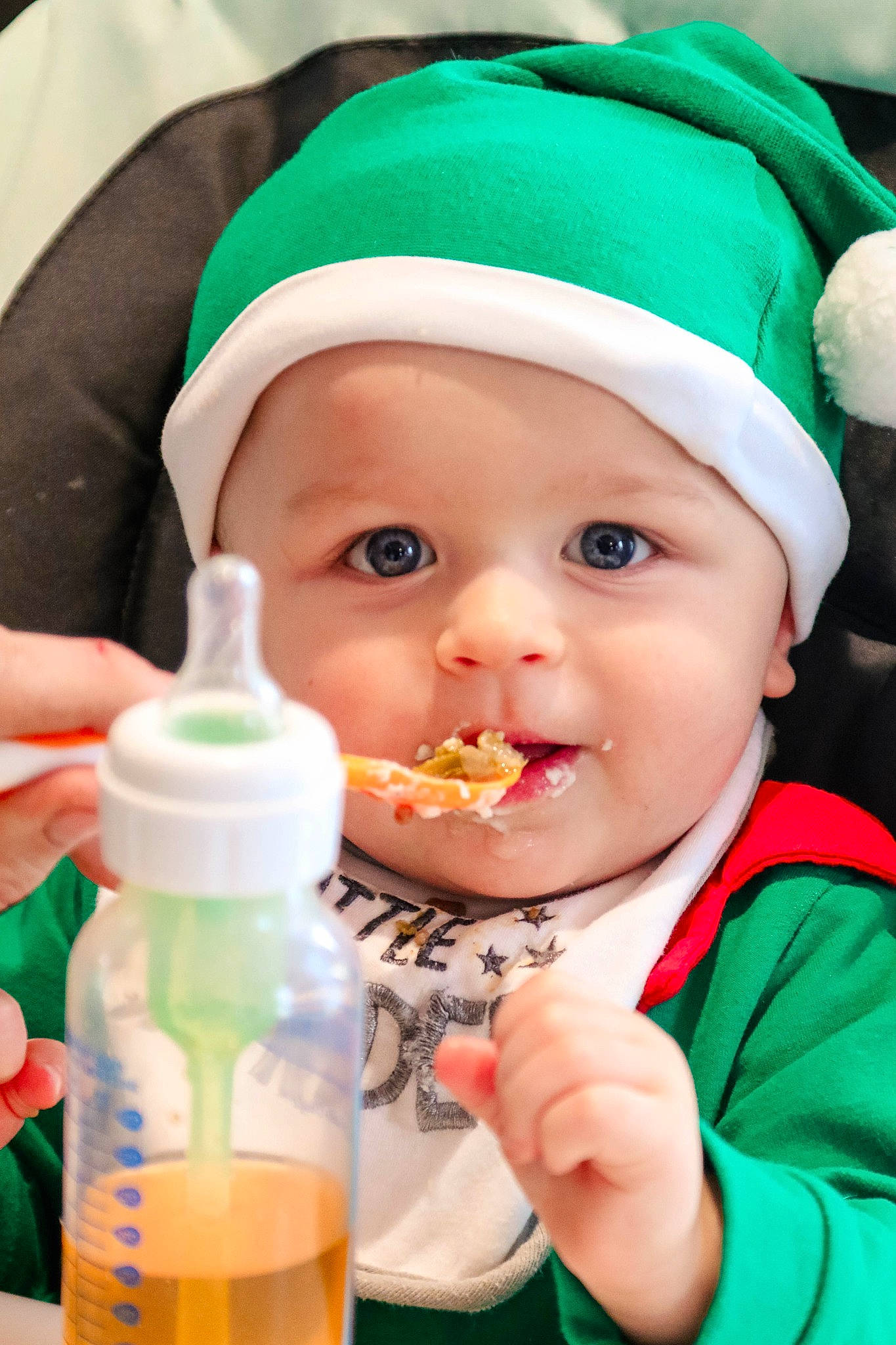 Abel joined the competition — help win amazing prizes! baby, baby_bottle, bottle, bottle_cap, cap, child, drink, drinkware, facial_expression, finger, fluid, fun, green, happy, headwear, liquid, person, plastic_bottle, product, skin