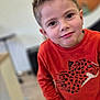Ayden participe au concours pour gagner de l'argent avec cette photo : child, boy, portrait, indoor, orange_sweatshirt, leopard_print, smile, curious, short_hair, casual_clothing, young, person, face, head, eyes, standing, floor, blurred_background, lighting, expression