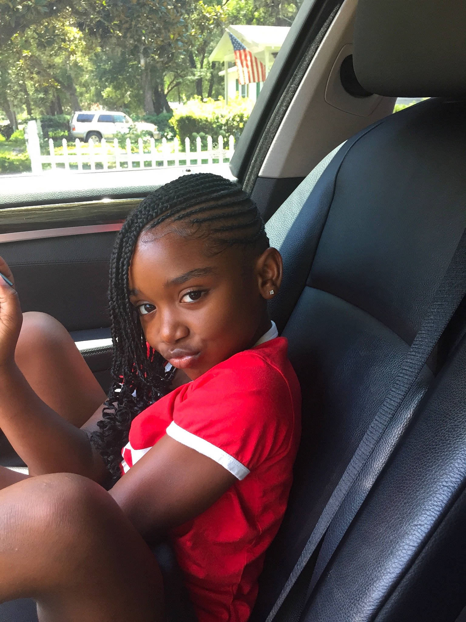 Zenobia is registered to the contest to win money with this photo: auto_part, automotive_exterior, automotive_window_part, black_hair, car, car_seat, car_seat_cover, child, driving, family_car, passenger, person, plant, seat_belt, sitting, steering_part, steering_wheel, toddler, vacation, vehicle