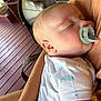 baby, sleeping, pacifier, arm, person, shirt, wooden_floor, fan, porch, infant, peaceful, closeup, child, rest, comfort, casual, relaxation, skin, clothing, summer